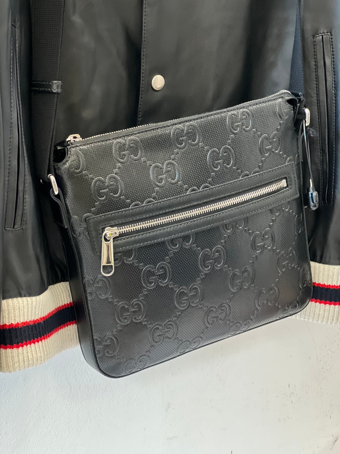 GUCCI GG EMBOSSED LEATHER SMALL MESSENGER BAG