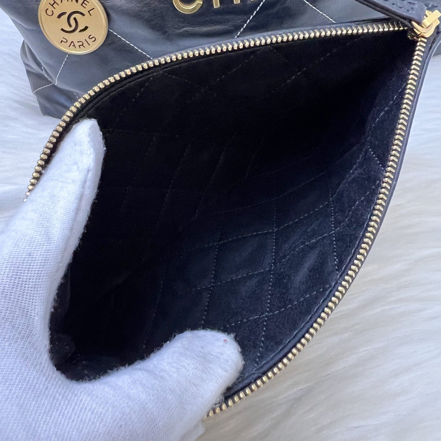 Chanel 22 Medium Hobo Handbag in Black Calfskin with White Stitch Quilting and AGHW (Model: AS3261)