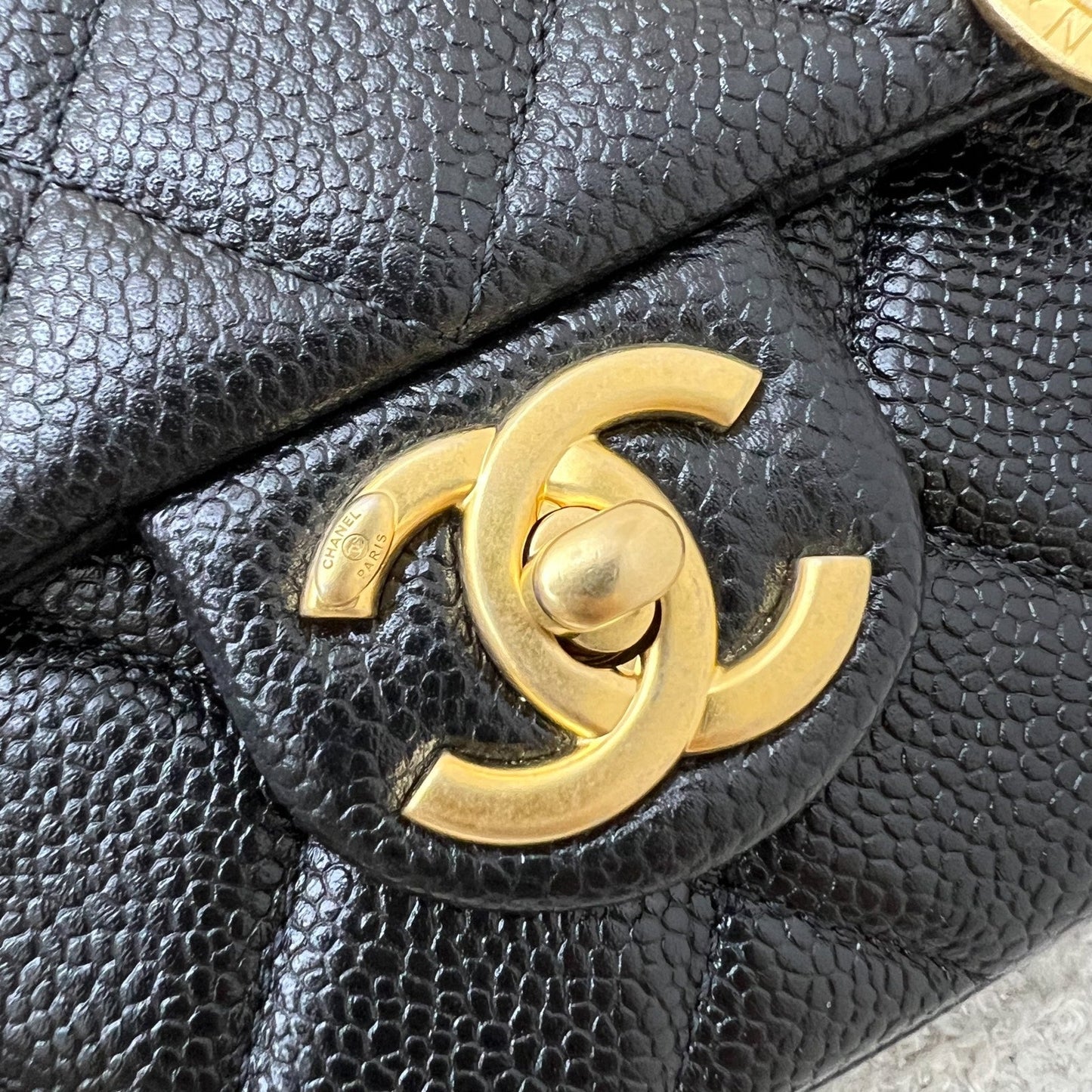 Chanel 21A Medallion Small Flap in Black Caviar and AGHW (Model: AS2528)