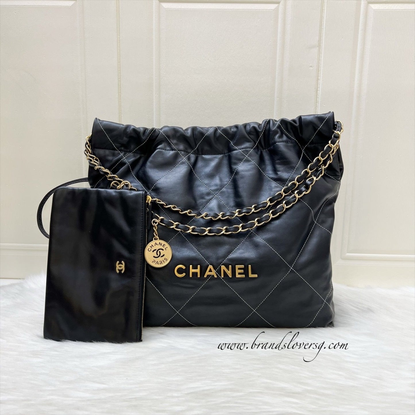 Chanel 22 Medium Hobo Handbag in Black Calfskin with White Stitch Quilting and AGHW (Model: AS3261)