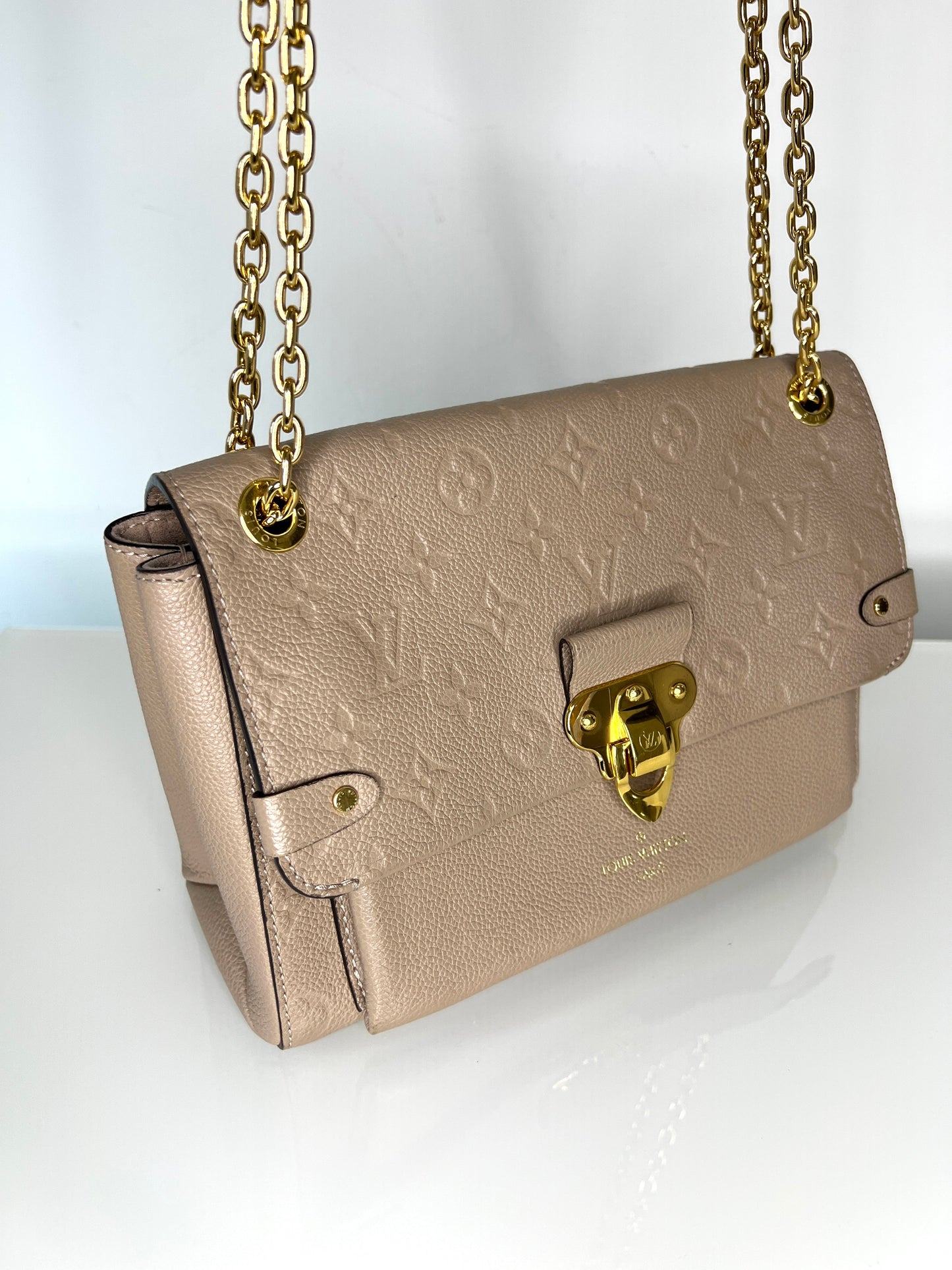 Louis Vuitton Pre-Loved Vavin PM beige Empreinte Leather Shoulder Bag