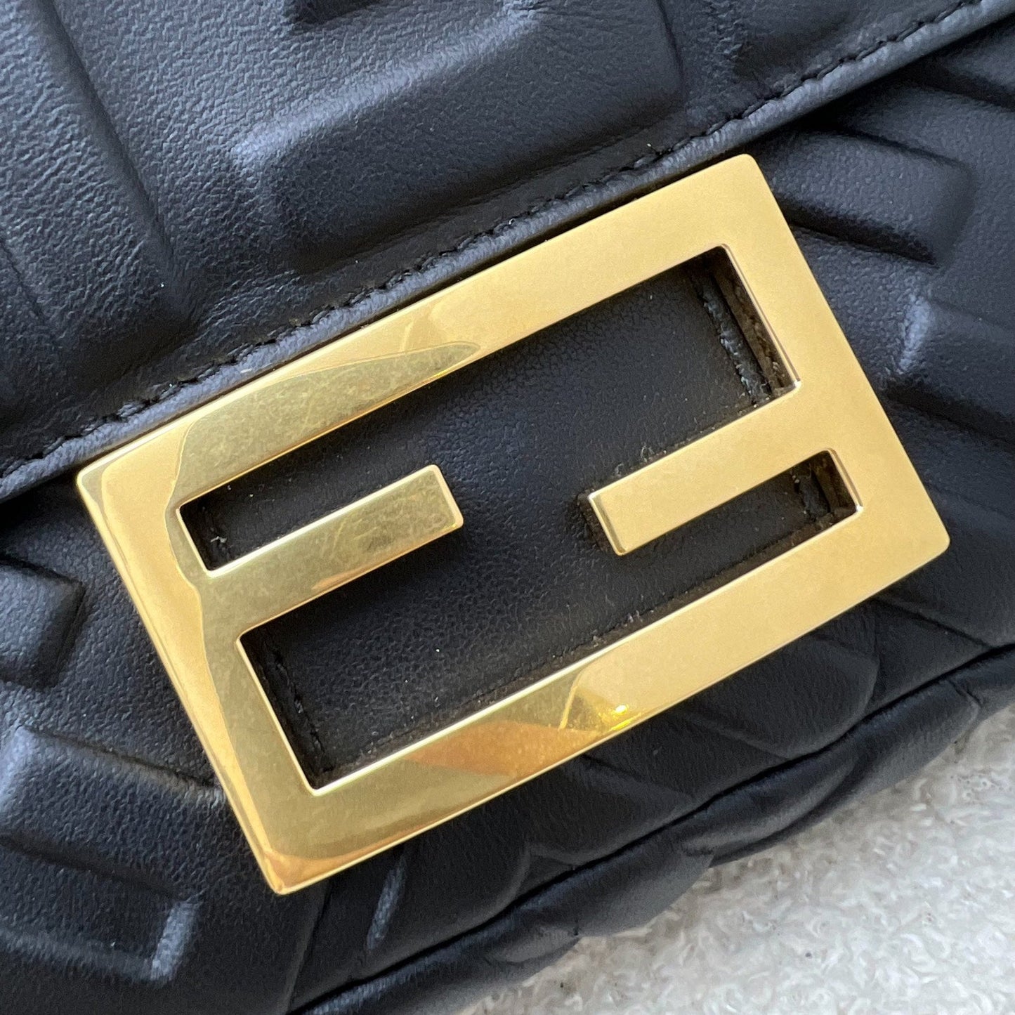 Fendi Mini Baguette Flap Bag in FF Motif Embossed Nappa Leather and GHW